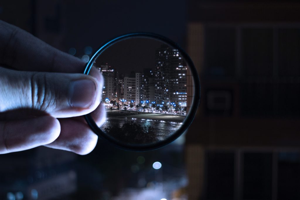 Magnifying glass looking on a city