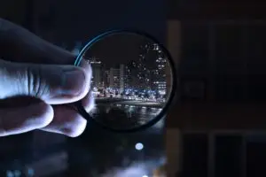 Magnifying glass looking on a city