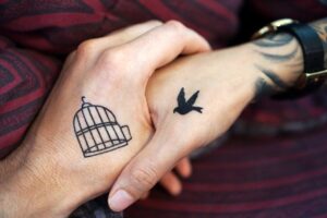 tattoo bird in a cage